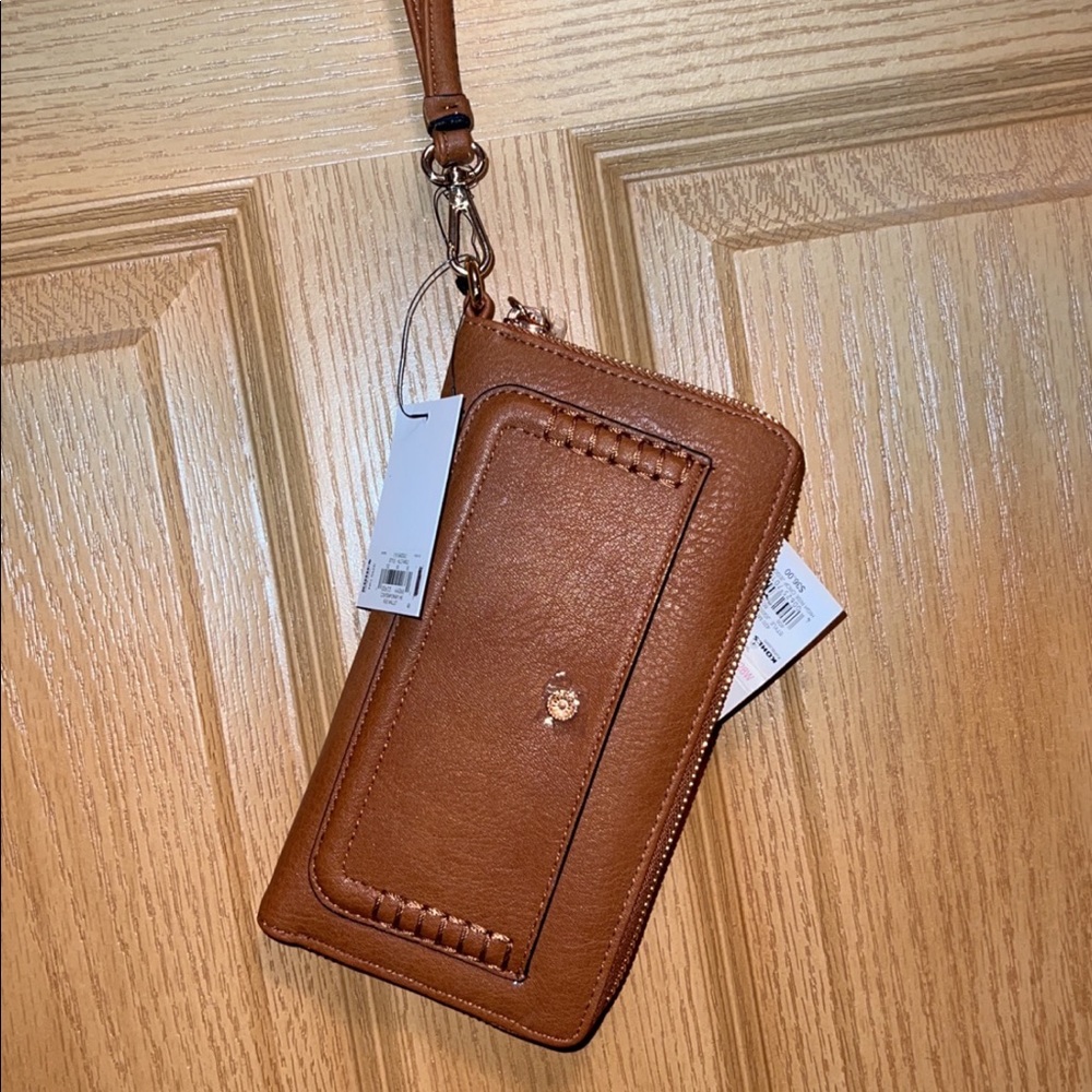 Tan leather wristlet. Brand new with tags